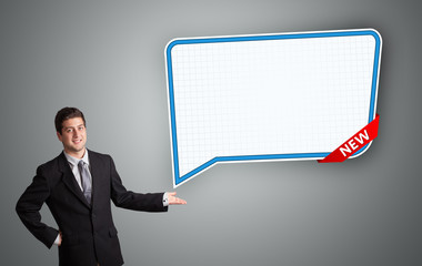 young man presenting modern speech bubble copy space