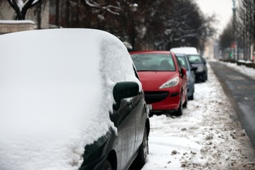 Cars covered in snow after blizzard