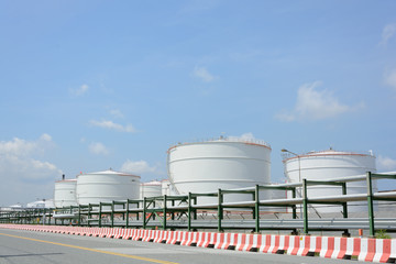 row of large white tanks for petrol and oil in Thailand