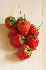 Strawberries over wooden table