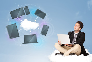 Happy businessman sitting on cloud enjoying cloud network servic