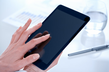 Business Woman using digital tablet in office