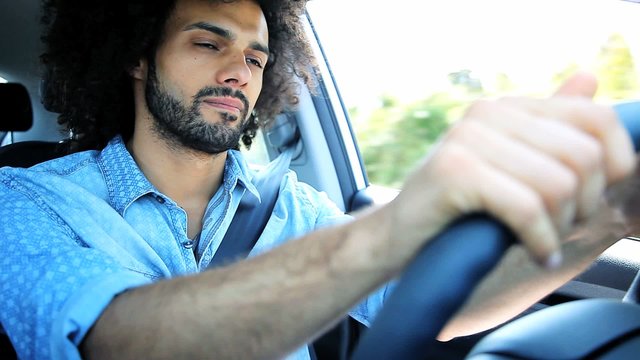 Serious sad angry man driving car