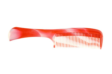 Red and white plastic comb isolated