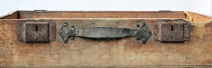detail of lock of an old wooden suitcase