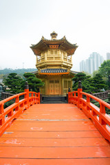 Naklejka premium The Golden pavilion and red bridge in Nan Lian Garden, Hong Kong