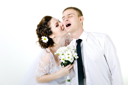 young happy bride and groom on a white background