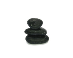 Stack of colored pebble stones on white background