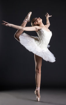 Image of flexible cute ballerina dancing in studio