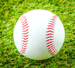 Baseball on green grass