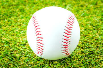 Baseball on green grass