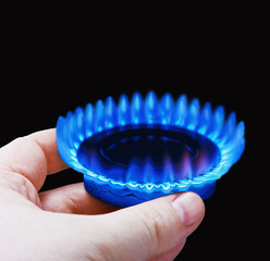 Hands holding a flame gas