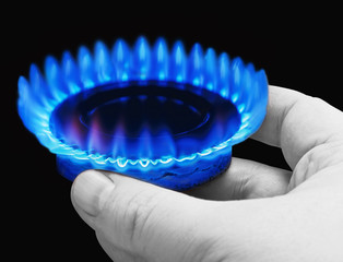 Hands holding a flame gas