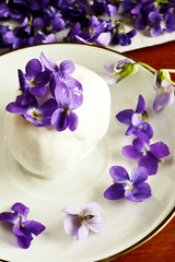 Homemade ice cream decorated violets flowers