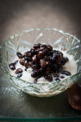 Thailand dessert sticky rice with black beans and coconut cream