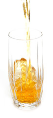 Juice pouring into glass isolated on white