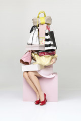 Young businesswoman behind the wall of shopping