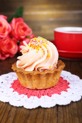 Tasty cake on table on wooden background