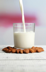 Almond milk is poured into glass,
