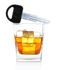 Composition with car key and glass of whiskey, isolated on