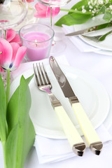 Table setting with spring flowers close up