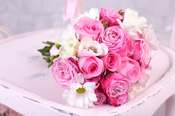 Beautiful wedding bouquet on wooden chair
