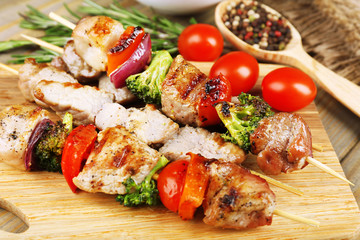 Pork kebab on wooden table close up