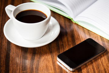 Obraz na płótnie Canvas Smart phone with coffee