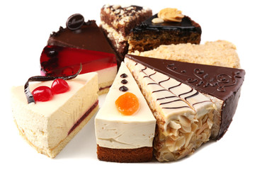 Assortment of pieces of cake, isolated on white © Africa Studio