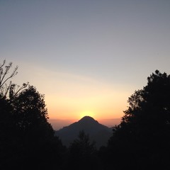sunset behind mountain