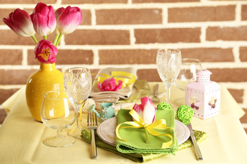 Beautiful spring table setting on bright background