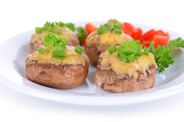 Stuffed mushrooms on plate isolated on white