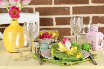 Beautiful spring table setting on bright background