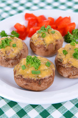 Stuffed mushrooms on plate on table close-up