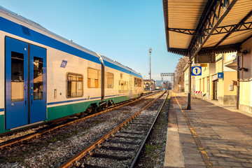 Fototapeta na wymiar Train on empty station in Alba, Italy.