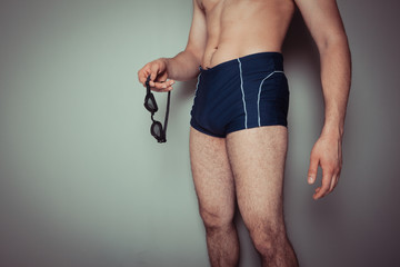 Young man in swimming trunks
