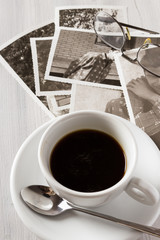 Memories. Cup of coffee and old photos