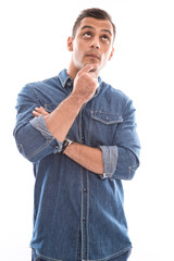 Pensive isolated attractive man over white.