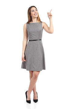 Full body of a standing woman pointing at side