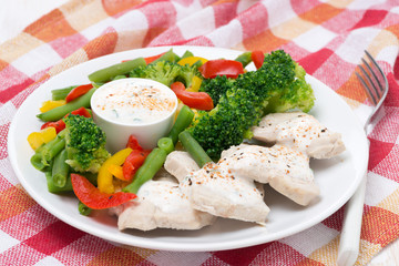chicken fillet, steamed vegetables and yoghurt sauce