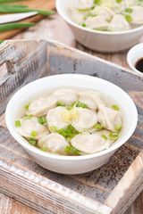 chicken soup with Chinese dumplings, vertical