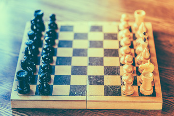 Ancient wooden chess standing on chessboard © Great Brut Here