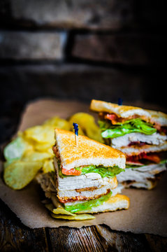 Club sandwich on rustic wooden background