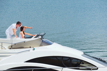 Fototapeta na wymiar young couple on yacht
