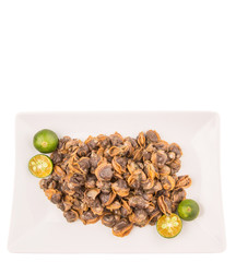 Fresh boiled cockle meat with calamansi fruit in a white plate