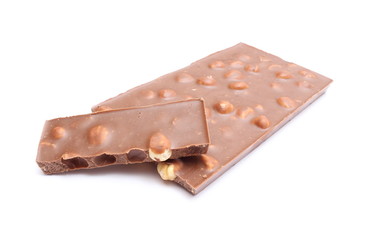 Portion of chocolate with nuts on white background