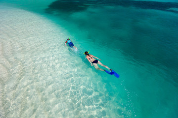 Mother and son snorkeling