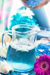 Preparing relaxing spa bath aromatic pouring salt