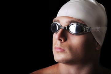 Male swimmer isolated on black