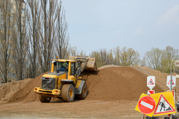 The wheel loader works at bridge construction